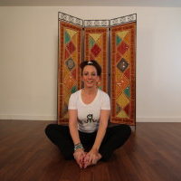 Young woman sitting on yoga pose | Santosh Yoga Institute in Salt Lake City, UT