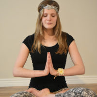 Young woman doing meditation yoga | Santosh Yoga Institute in Salt Lake City, UT