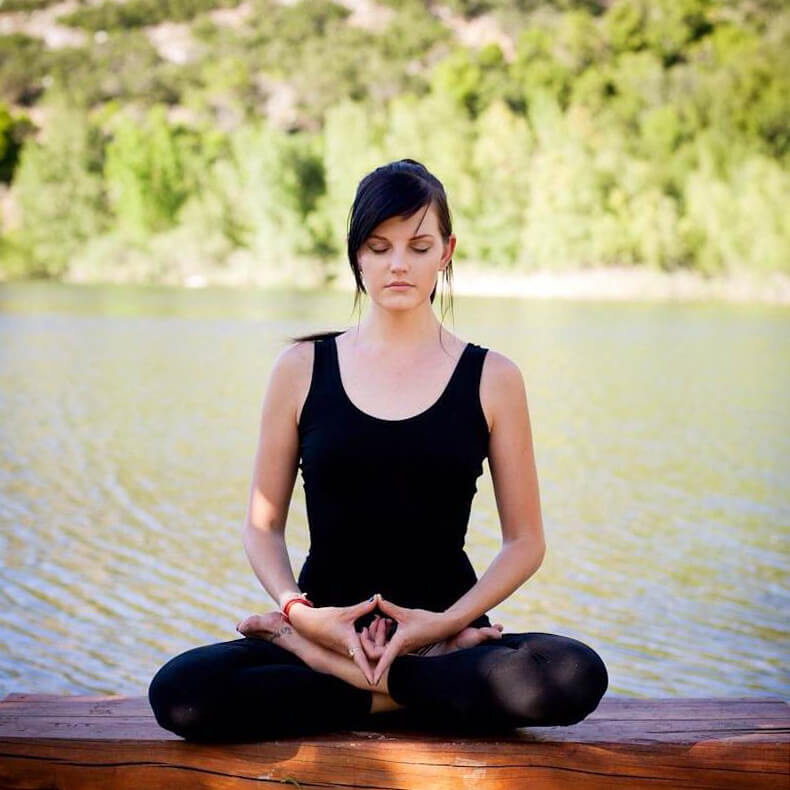Young Woman doing meditation outdoors | Santosh Yoga Institute in Salt Lake City, UT