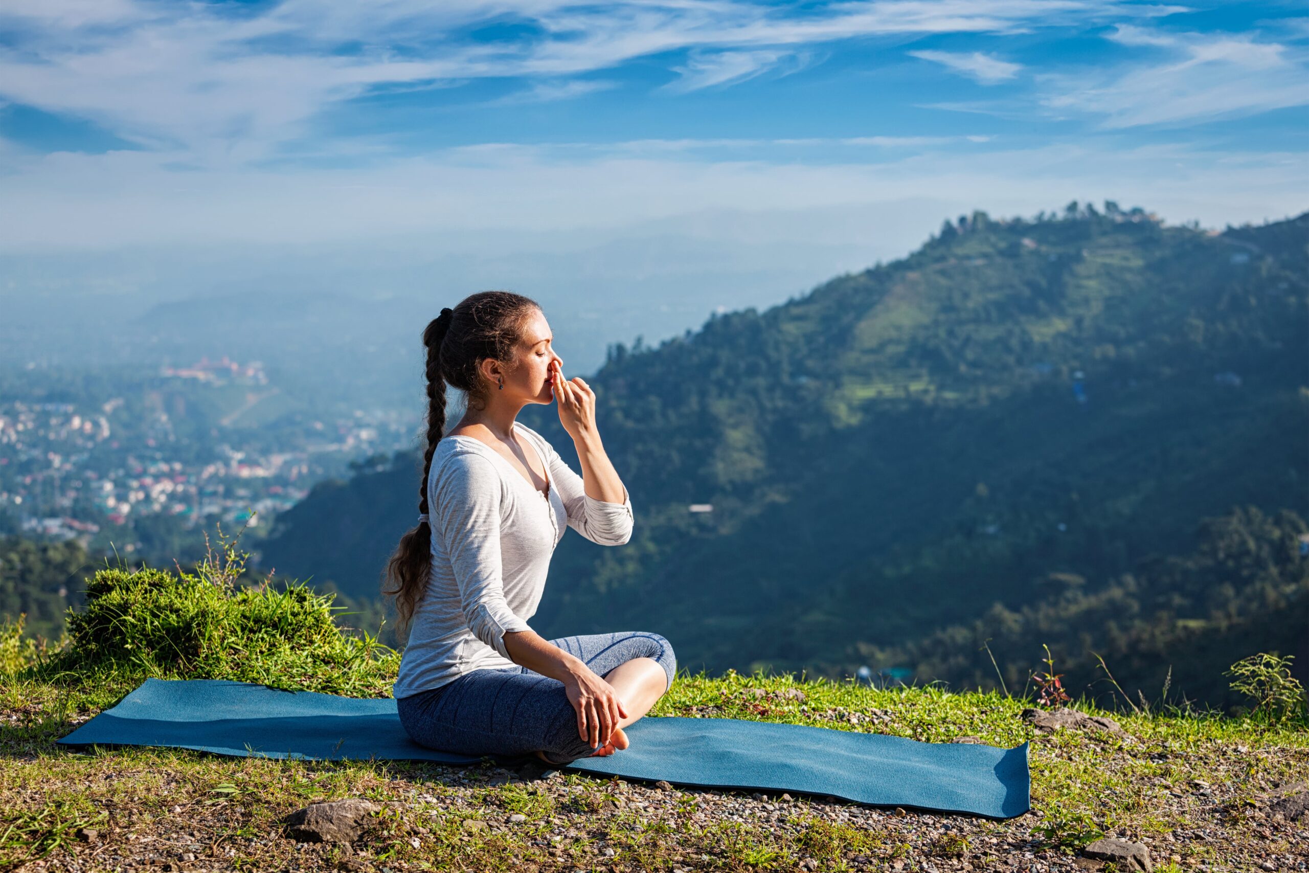 Young female doing pranayam yoga outdoor | Santosh Yoga Institute in Salt Lake City, UT