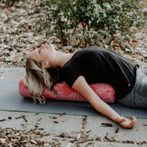 Woman Relaxing Outdoor Using Earth Elements Yoga Mat 3mm in Salt Lake City, UT | Santosh Yoga Institute