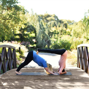 Flexible women doing yoga exercise outdoors using para rubber xl mat in Salt Lake City, UT | Santosh Yoga Institute