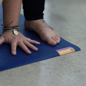 Man Doing Yoga Using Tapas Original Yoga Mat in Salt Lake City, UT | Santosh Yoga Institute