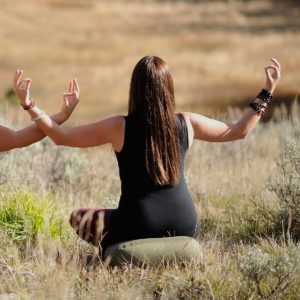 Woman back making with both hands pose in Salt Lake City, UT | Santosh Yoga Institute